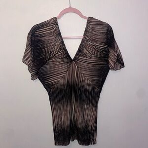 LIPSTICK CREAM AND BLACK BATHING SUIT COVER UP